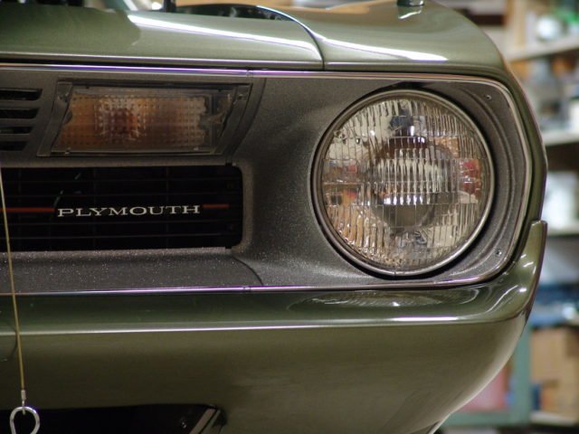 1970 'Cuda Mod Top Hemi. Numberss matching. 1 of 1. This was the only 'Cuda built in 1970 that was a hemi with automatic transmission, F-8 Green paint and a Mod Top. This car was highly optioned. Extensive restoration of body and paint took approximately 14 months to complete. The body was painted like factory with orange peel finish. This car has not been buffed. All body panels were installed and aligned prior to paint except the front bumper and the front and rear lower valances as the factory did. Primer and paint were matched to factory colors. This car was primed, painted and undercoated - overspray included - as the factory.